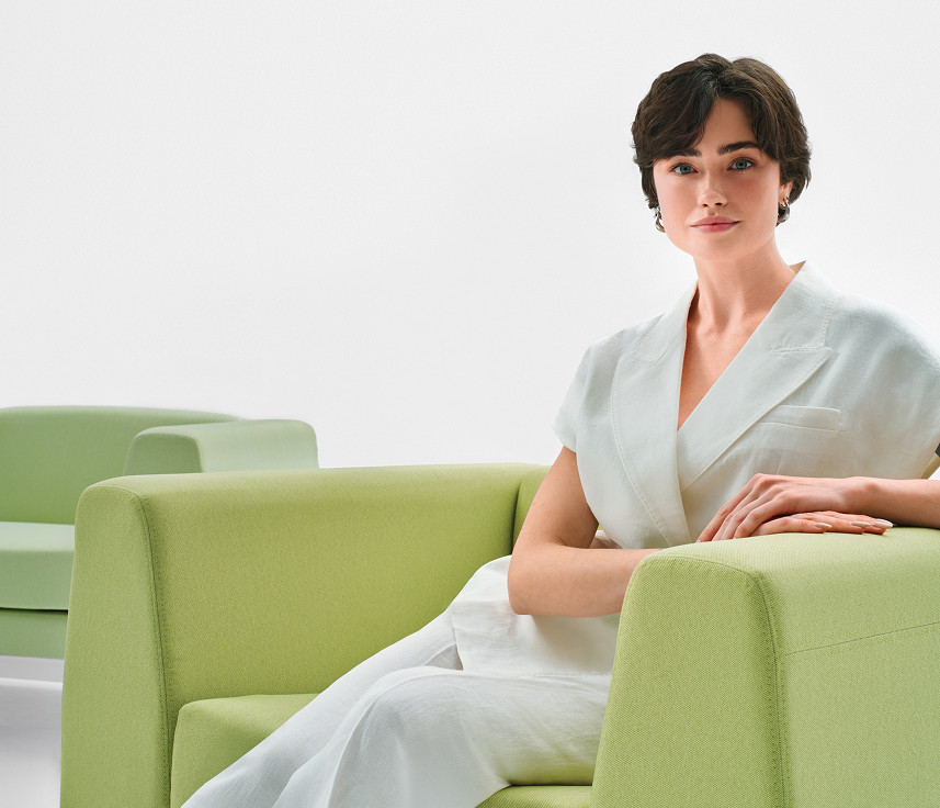 Woman seated in modular breakout office furniture