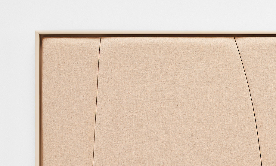 Close-up of a framed acoustic panel with fabric finish