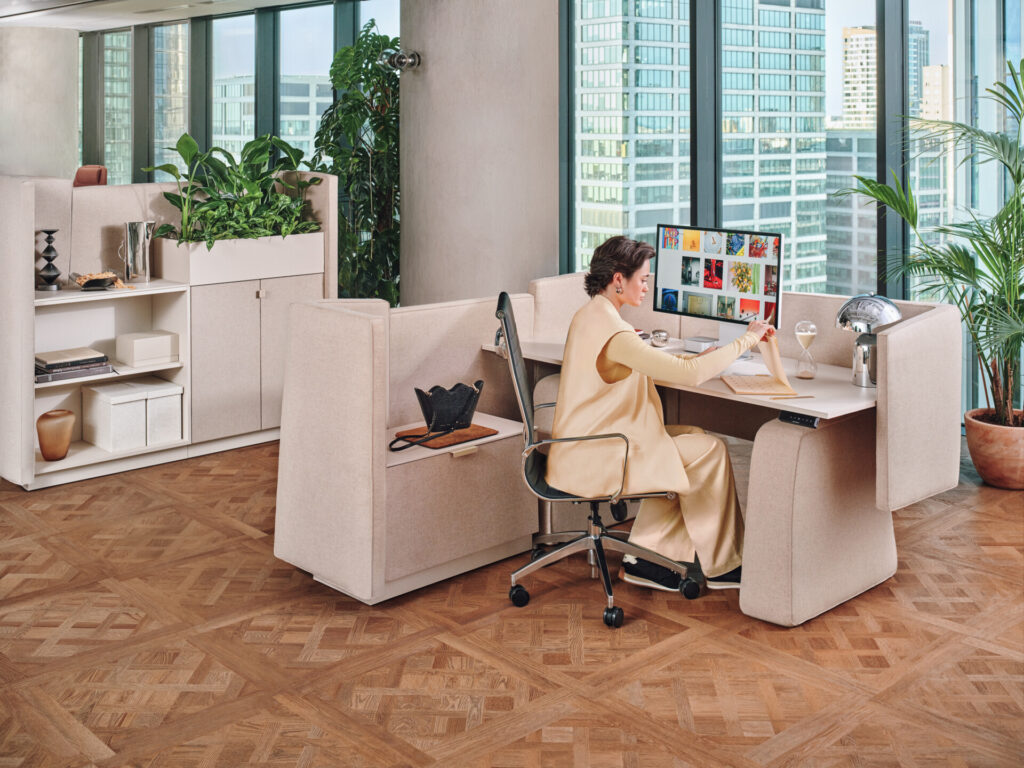 Soma modular breakout office furniture with seated worker and storage units