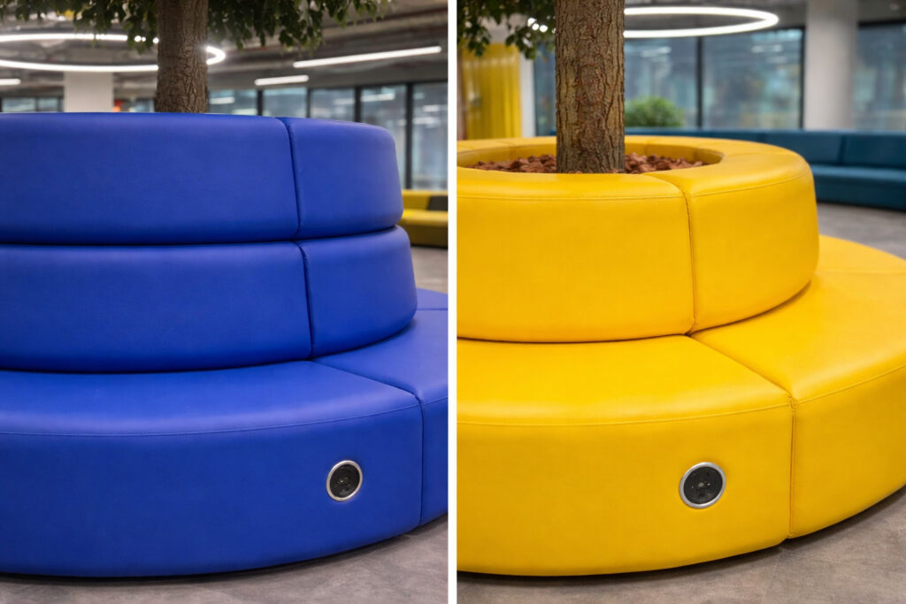 Blue and yellow modular Ally breakout seating around trees in an office environment