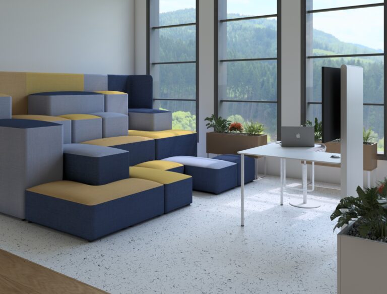 Office breakout area with modular seating, conference table, and large windows