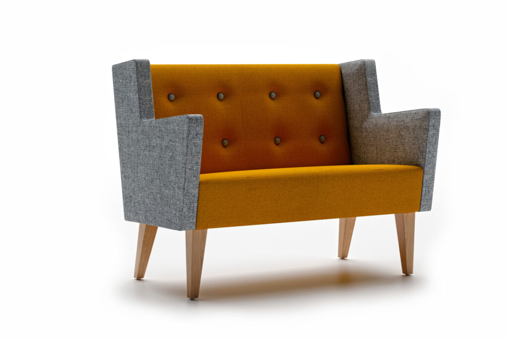 Modular breakout office seating with upholstered back and seat, and wooden legs