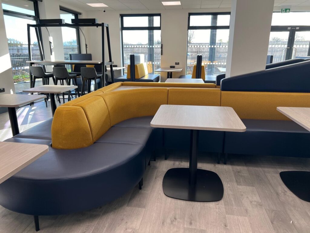 Office breakout area with modular seating and breakout tables