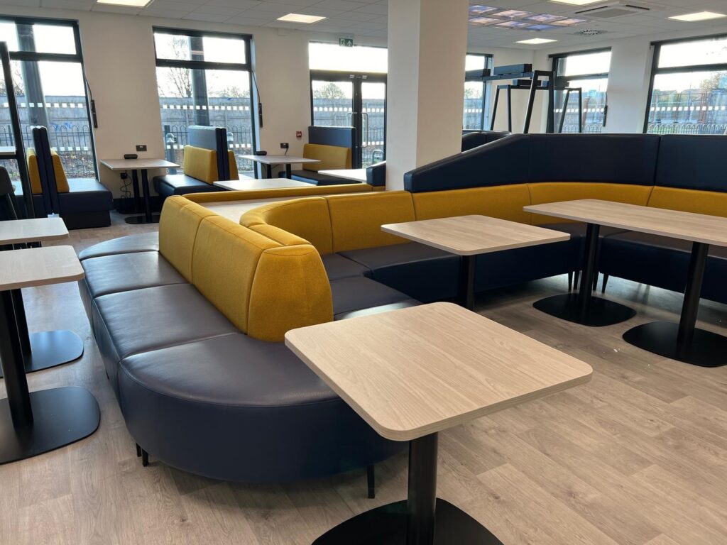 Office breakout area with modular seating and breakout tables