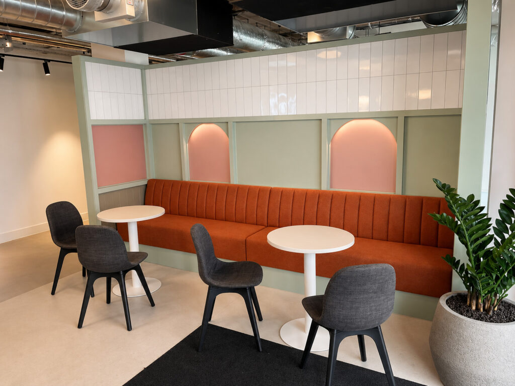 Office breakout area with bespoke modular seating and round tables