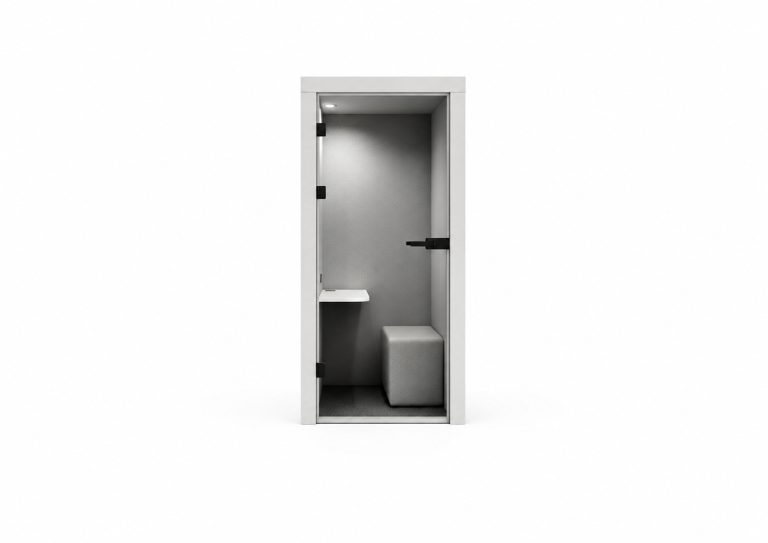 Acoustic phone booth with light grey interior, small white shelf, and grey upholstered stool