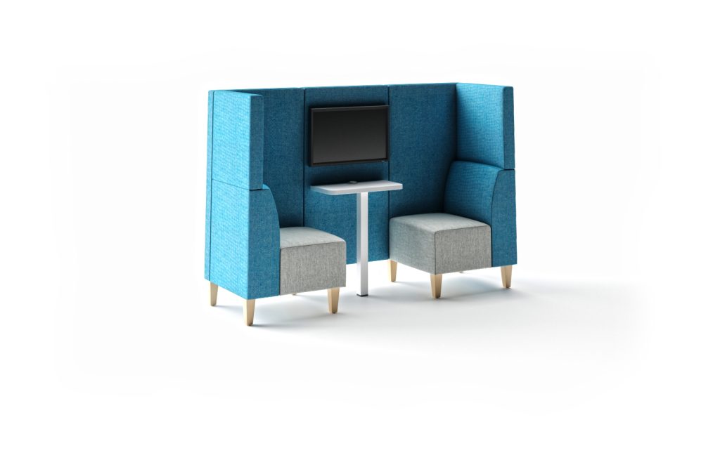 Modular breakout seating with high back panels, two chairs, a small table, and a monitor.