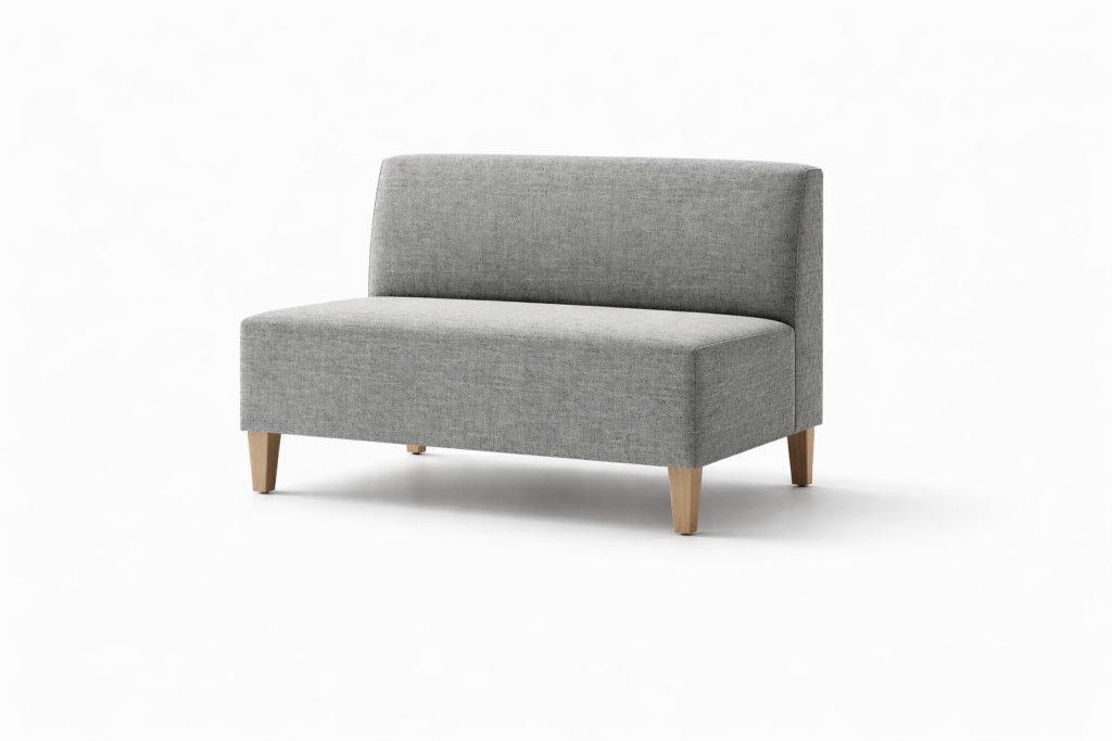 Modular breakout seating unit with a low back and wooden legs, for office, education, or reception spaces.