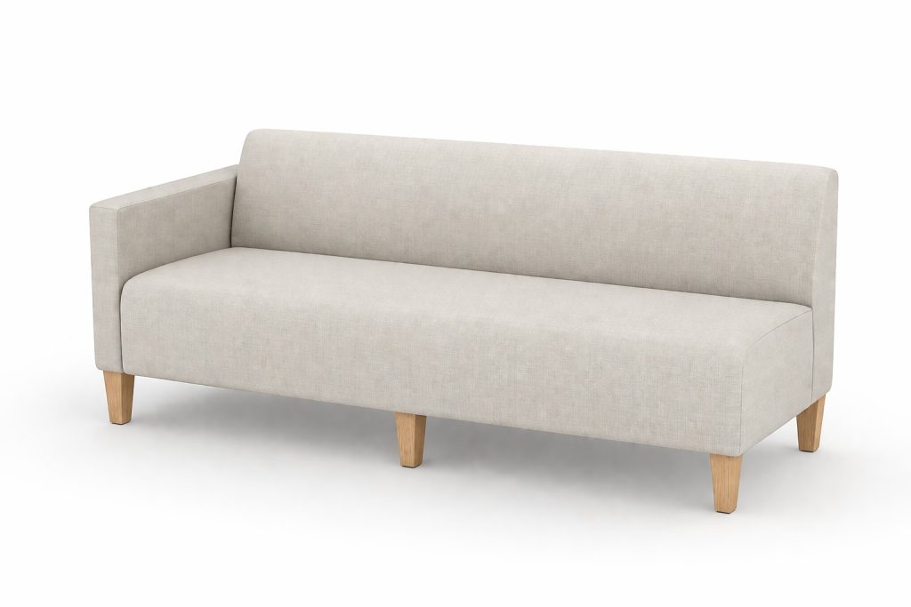 Modular breakout seating, light fabric sofa with one armrest and wooden legs.