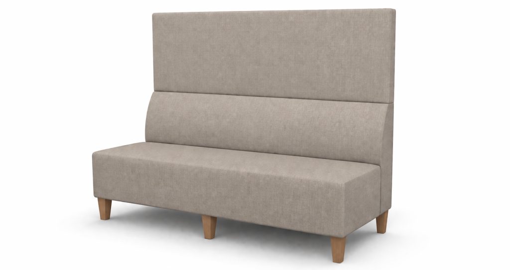 Modular breakout seating with high back, upholstered in light fabric, on wooden legs.