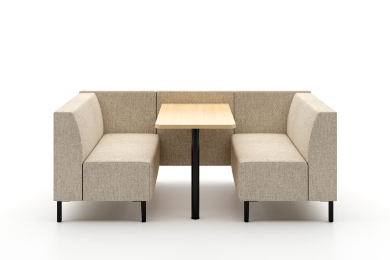 Modular breakout seating with a light wood table, black legs, and high back panels.