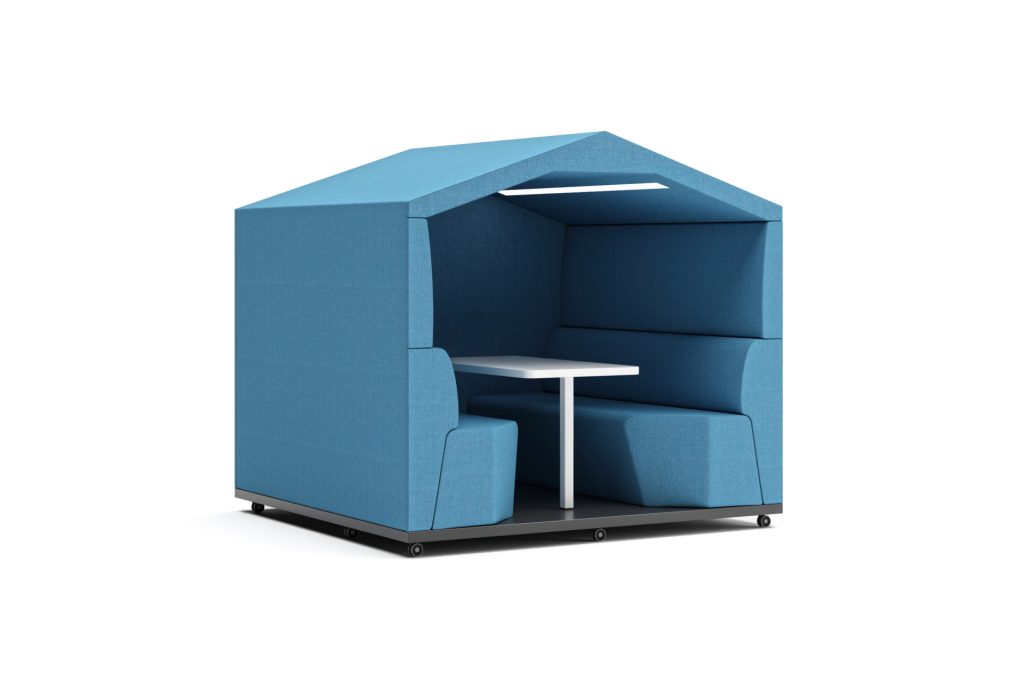 Modular acoustic office pod with pitched roof, integrated seating, table, and lighting.