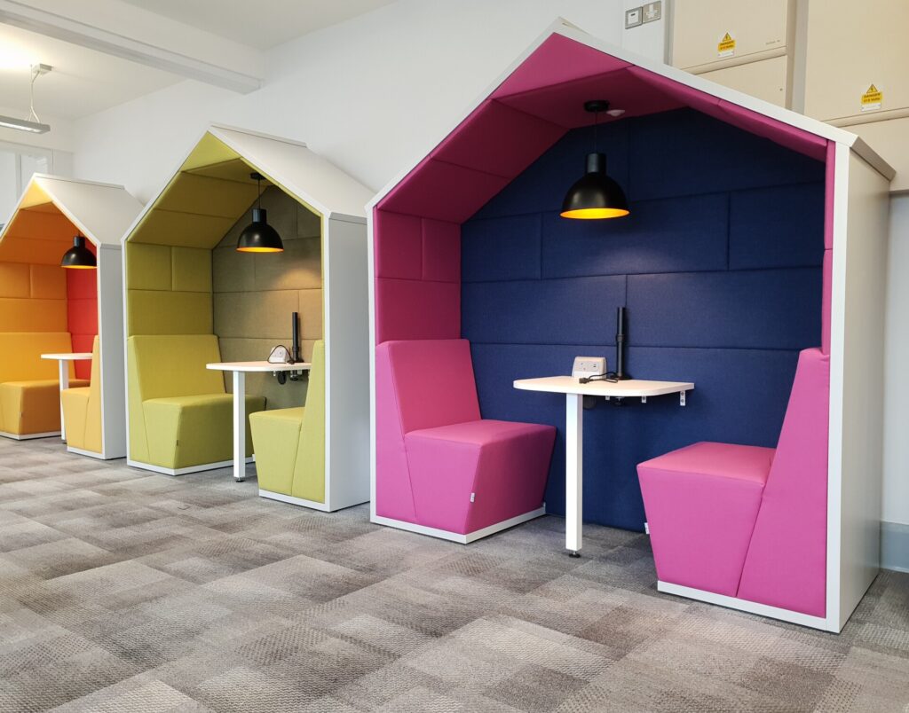 Row of Session meeting booths with modular seating and tables in an office breakout area